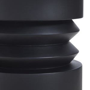 Talpa end table showing detailed view of the sculptural black base with layered design.