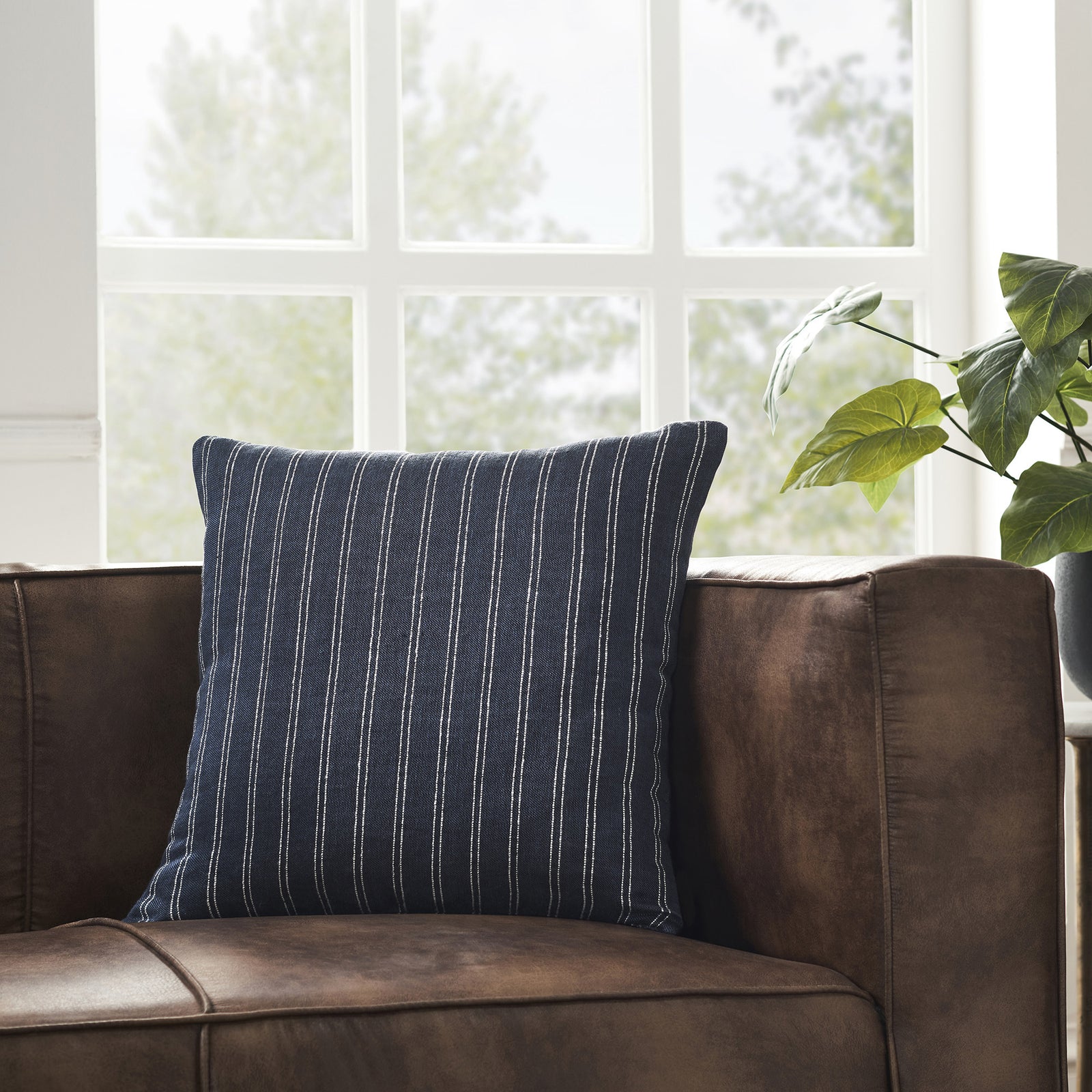 Oakley Indoor Pillow in dark blue with white vertical stripes, textured fabric.