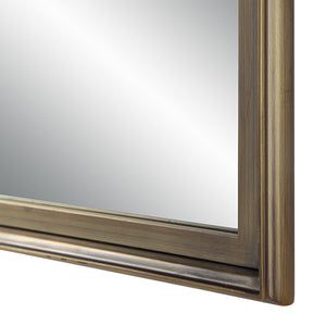 Close-up of Sandcastle Wall Mirror's bronze frame highlighting its textured finish.