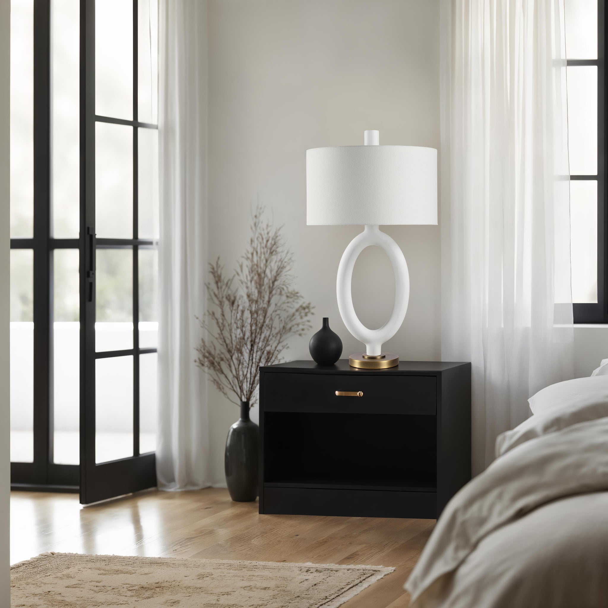 Aeris Table Lamp placed on a black nightstand in a cozy bedroom setting with natural light.