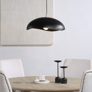 Filomena Ceiling Fixture above a dining table, illuminating a cozy setting with decor.