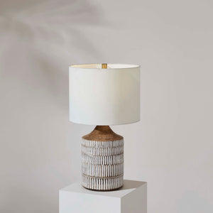 Wickes Table Lamp by Renwil displayed on a pedestal with a white shade and brown base.