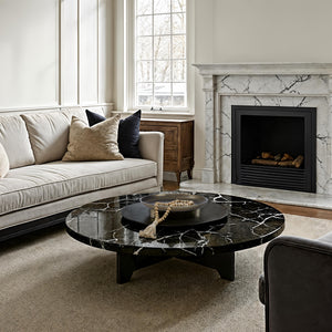 Kaleido Indoor Cast Aluminum Tray displayed on a black marble coffee table in a cozy living room