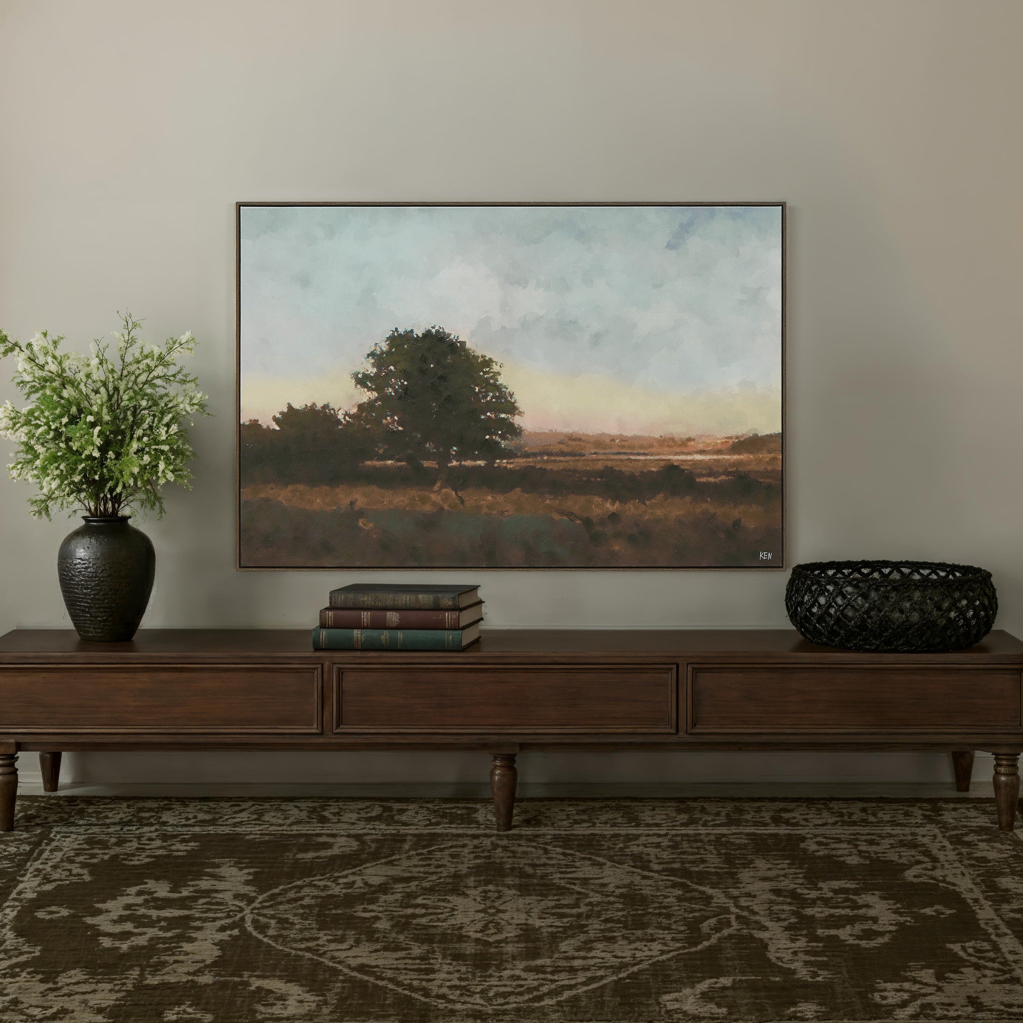 Horizon canvas art displayed in a living room setting above a wooden console table.