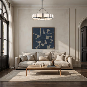 Valerio canvas art displayed in a living room setting above a beige sofa.