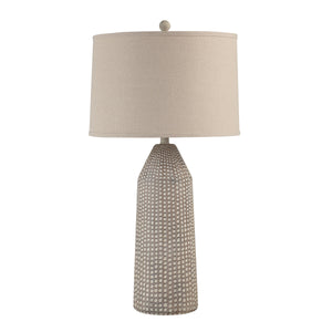 Lechuga Table Lamp with beige fabric shade and textured ceramic base in light gray.