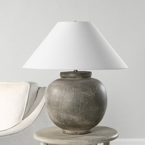 Olivia Table Lamp on a side table next to a light-colored sofa