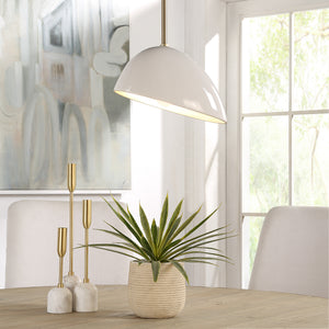 Corio Ceiling Fixture above a dining table with a plant and decorative candles.