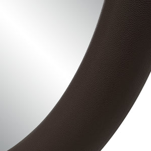 Close-up of Potro mirror showing the textured brown leather frame.