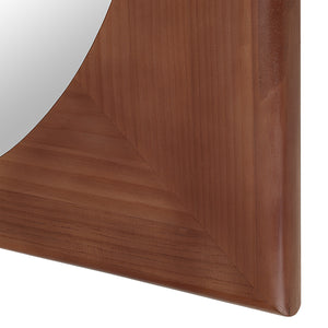 Close-up of Sitia mirror's brown wooden frame with angled corners.
