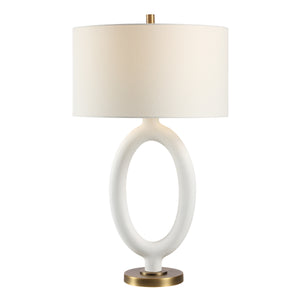 Aeris Table Lamp by Renwil featuring a white ceramic base with an oval cutout and a white fabric shade.
