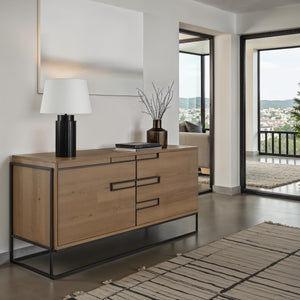 Stilus Table Lamp on a wooden sideboard in a modern living room setting