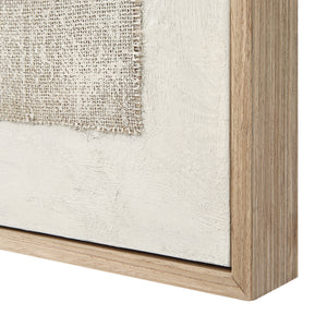 Picardy canvas art featuring a textured beige fabric patch framed in light wood, showcasing a minimalist design.