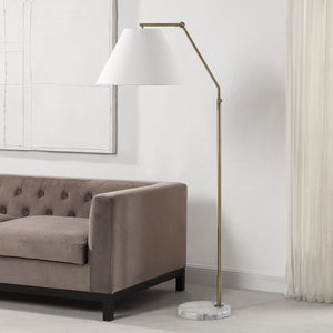 Claire Floor Lamp beside a gray velvet sofa in a modern living room
