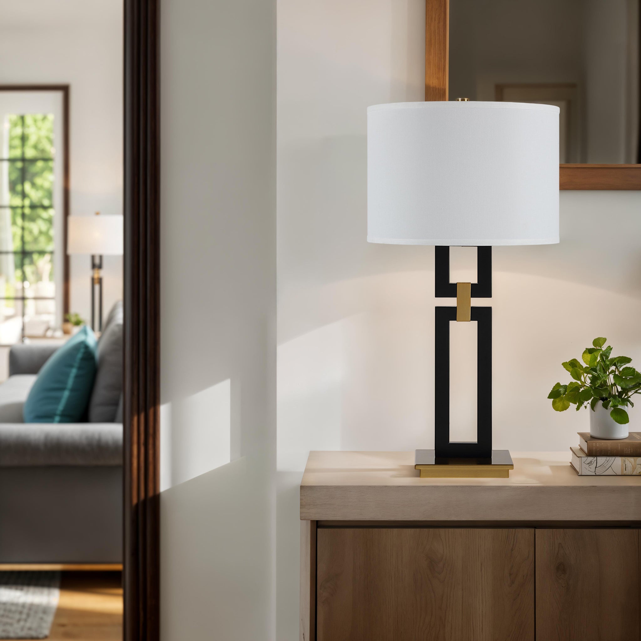 Lila Table Lamp on a wooden console in a bright living room setting.