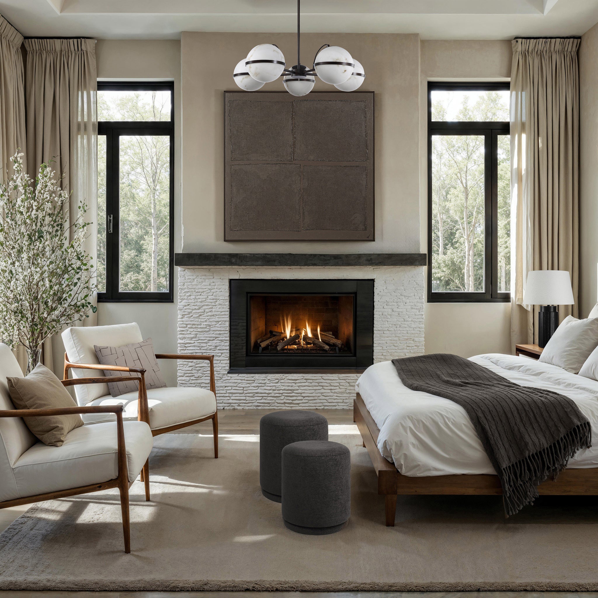 Two Hevea stools in dark gray in a cozy living room setting with a fireplace.
