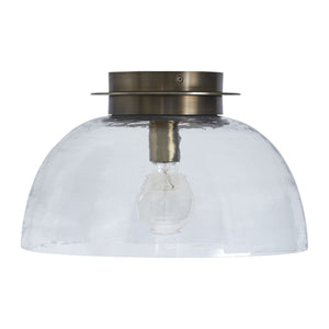 Liliane Flush Mount light with a clear glass dome and brass fixture, top view.