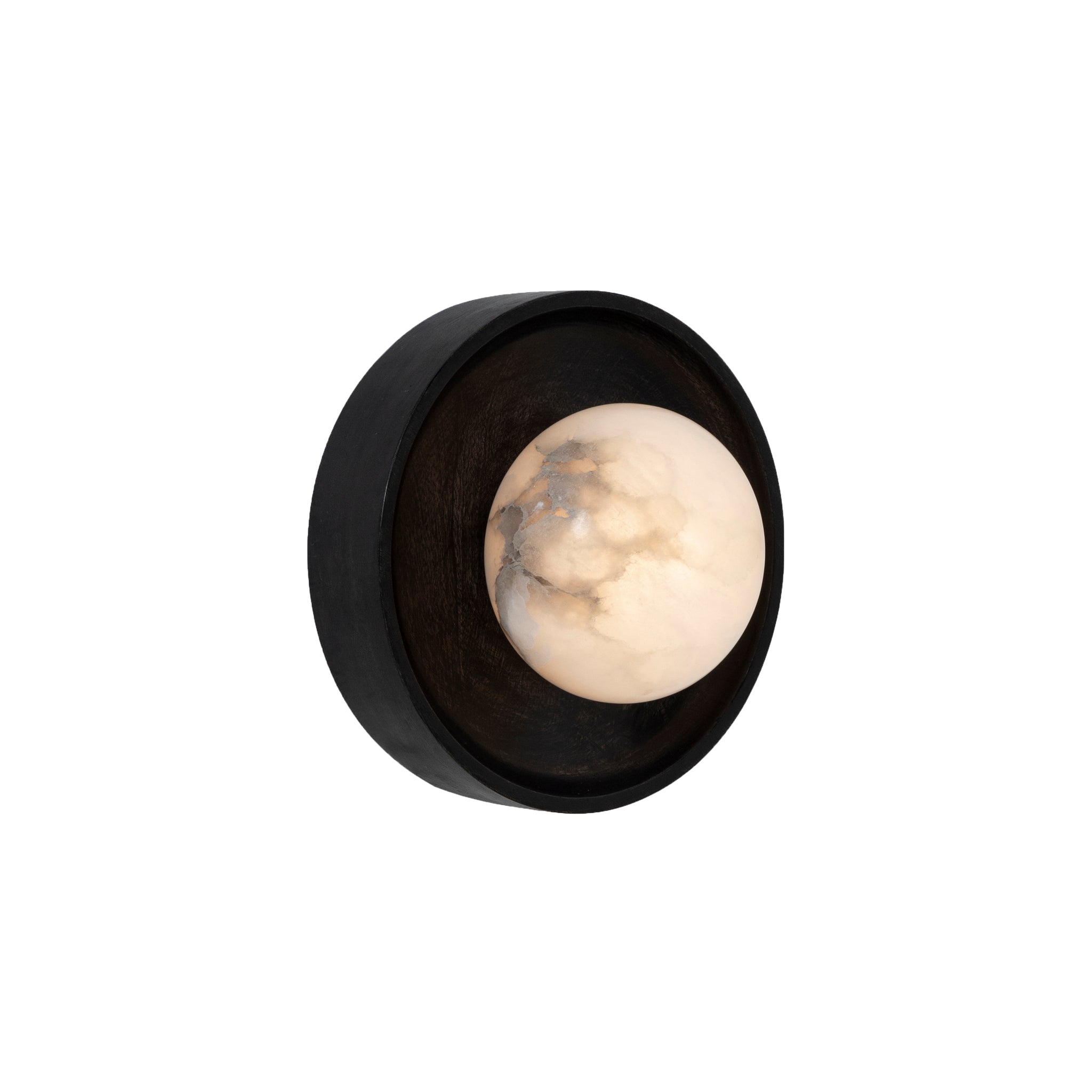 Haloa wall sconce featuring a lit alabaster bulb encased in a black wooden frame