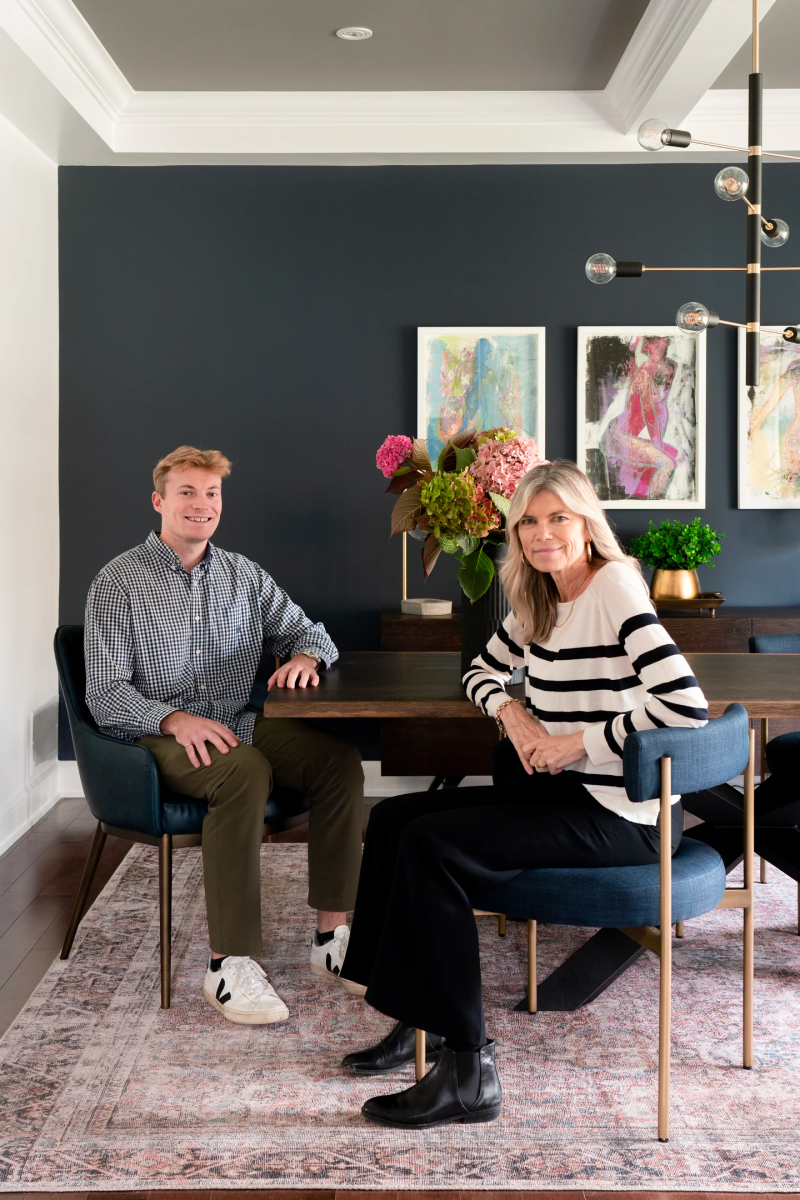 Laurie and Logan, the founders of Laurie Yapp Home, seated in their styled dining room.