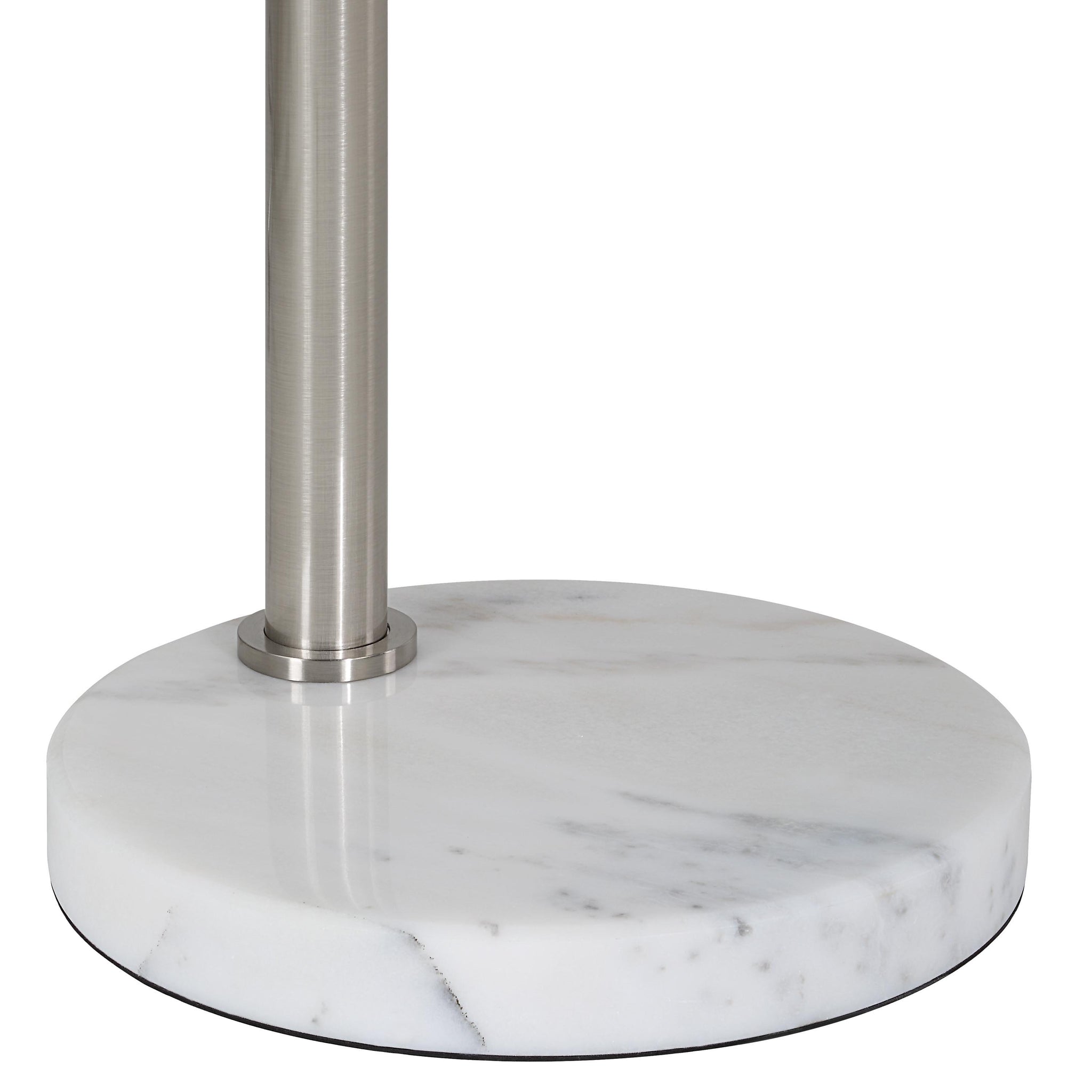 Close-up of Aglow floor lamp's round marble base and brushed metal pole.