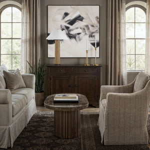 Clary canvas art featuring abstract black and beige design in a modern living room setting