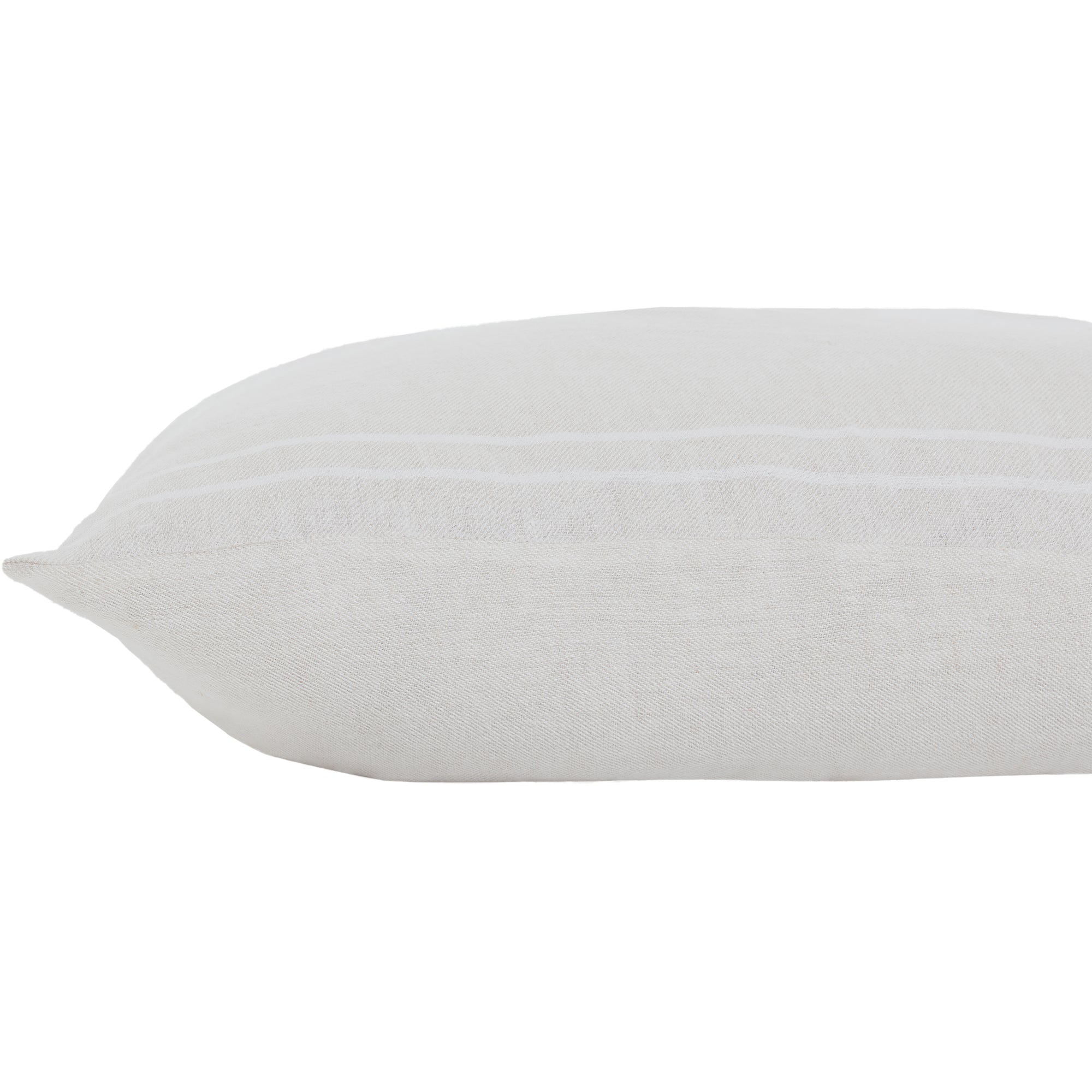 Another side view of Raelyn Indoor Pillow, emphasizing its soft texture and light gray hue.