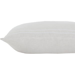 Another side view of Raelyn Indoor Pillow, emphasizing its soft texture and light gray hue.