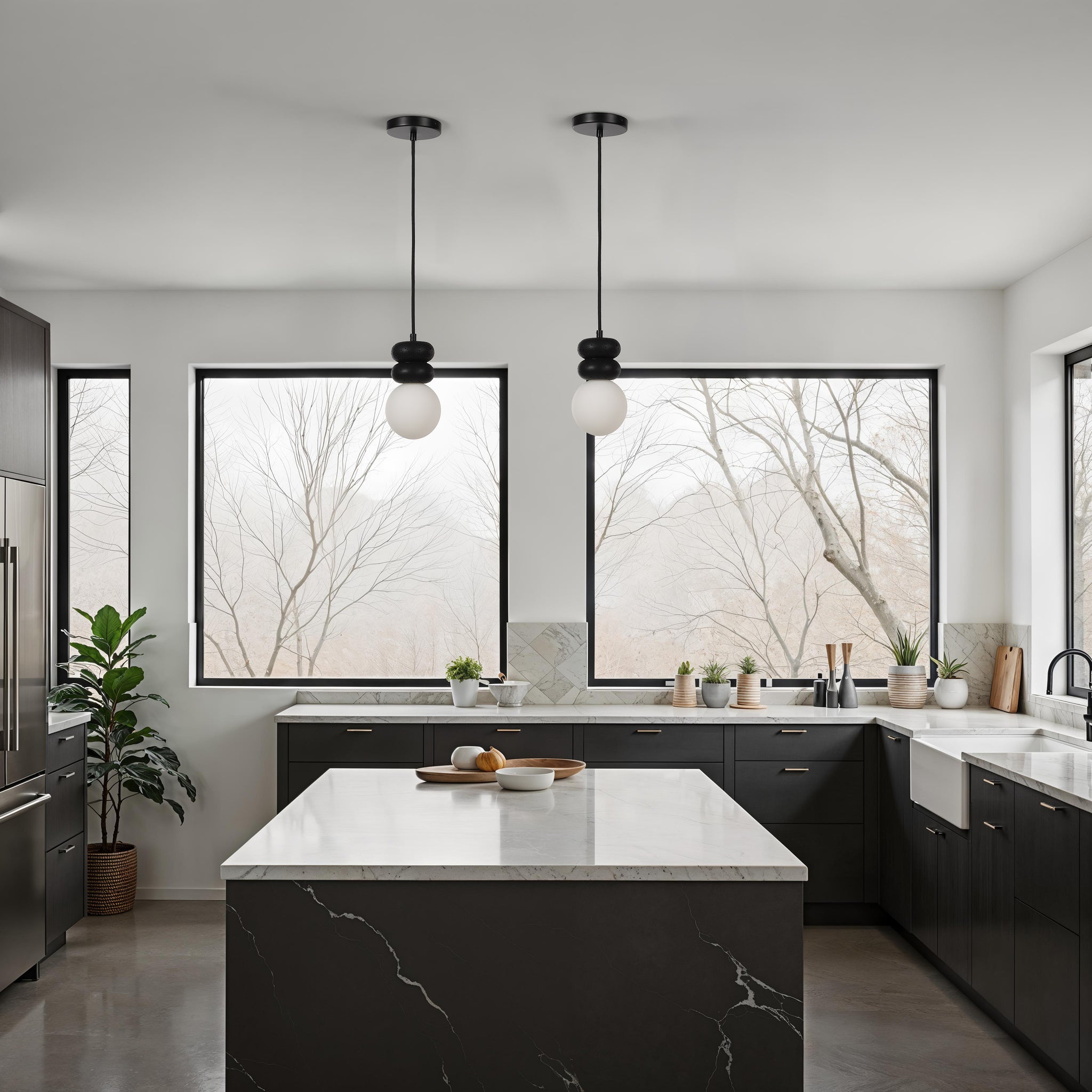 Stylish kitchen featuring two Solene pendant lights and large windows with greenery