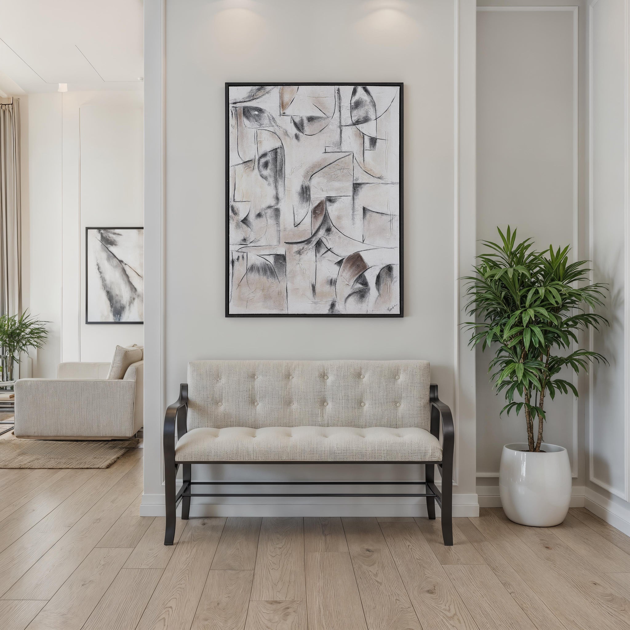 Yann canvas art hung above a beige bench in a modern interior setting.