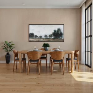 Westside canvas art displayed in a dining room setting above a wooden table.