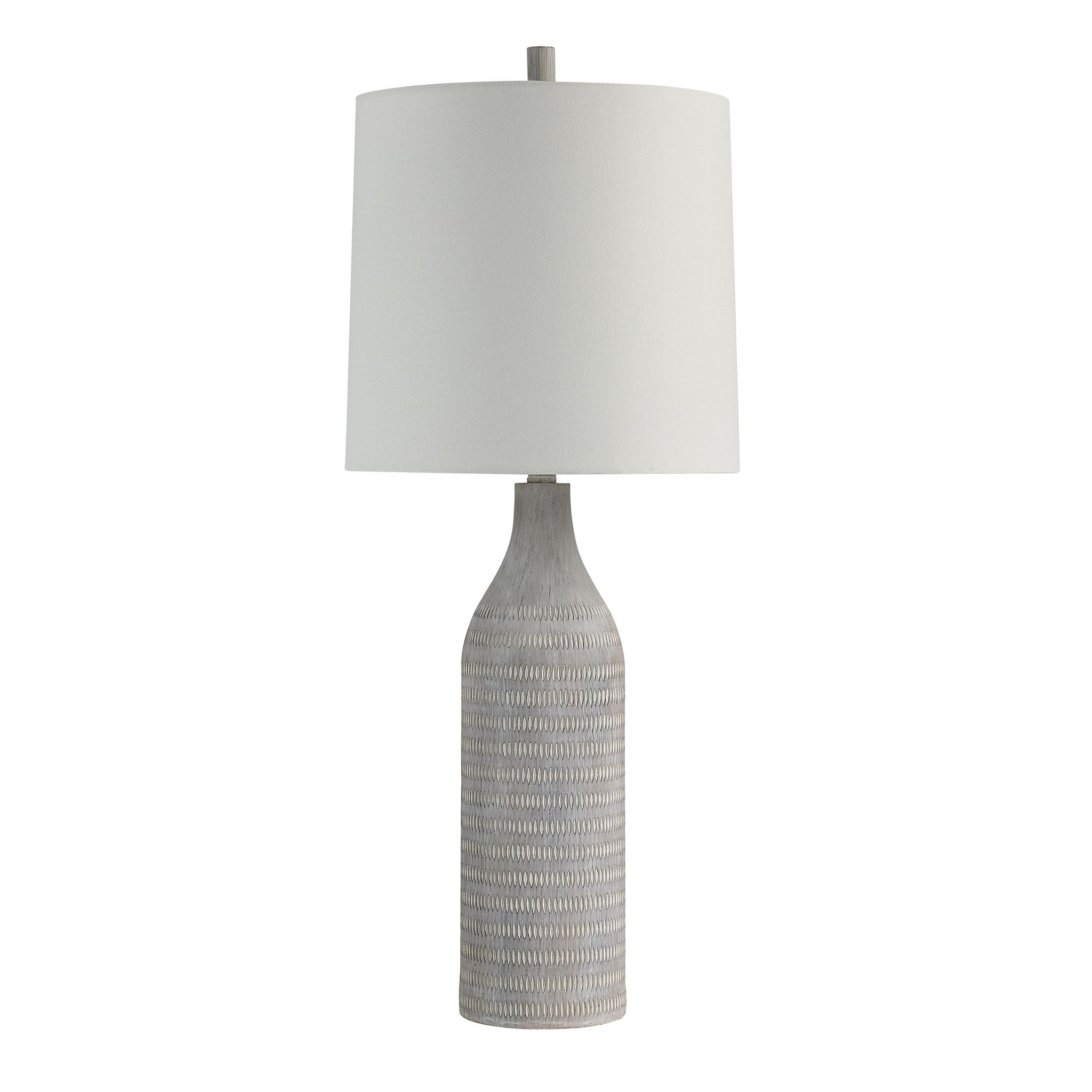 Baracoa table lamp with a textured gray ceramic base and white fabric shade.