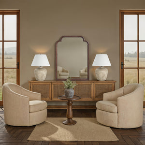 Octavian mirror by Renwil, featuring an arched wooden frame in a warm tone, reflecting a cozy interior.
