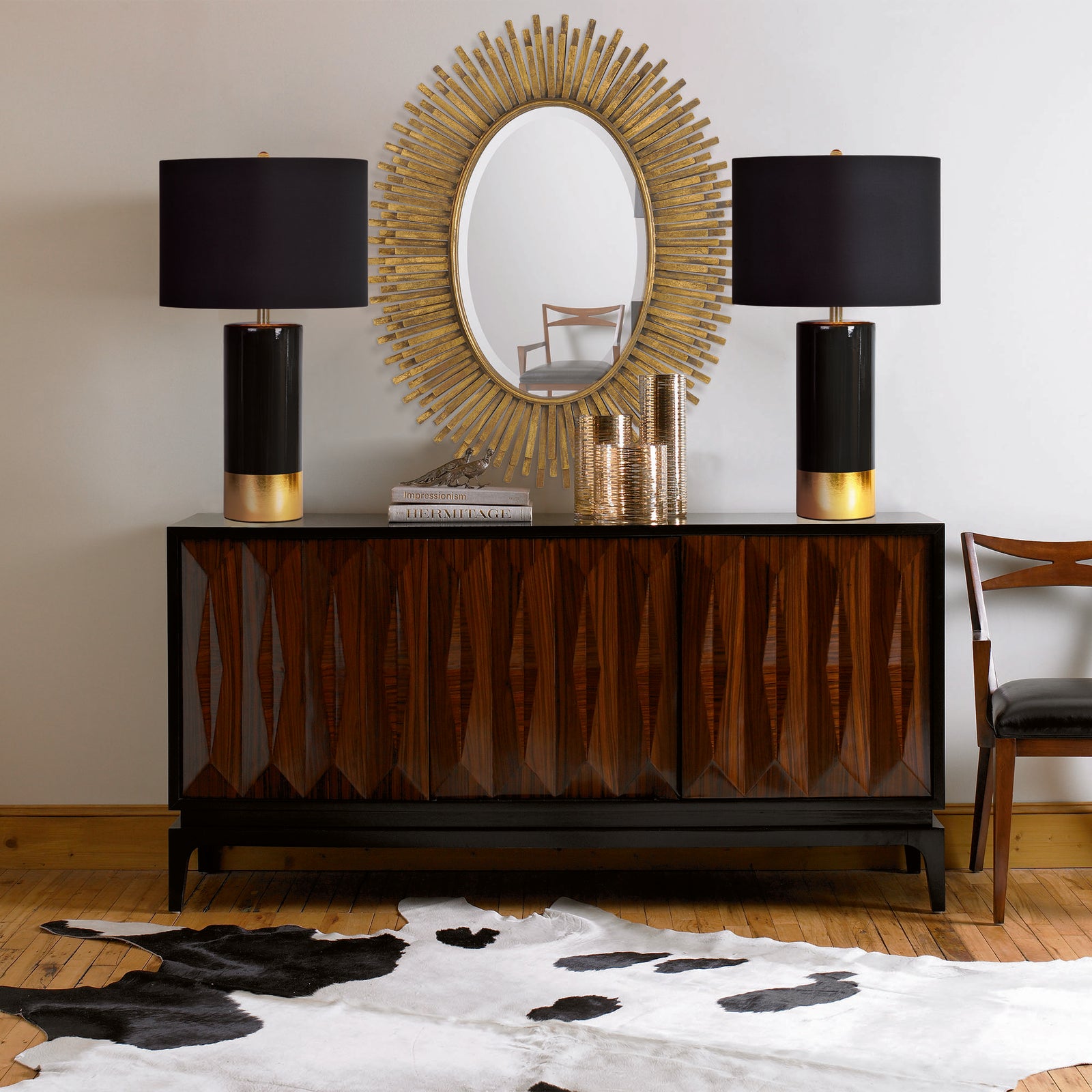The Tuxedo Table Lamp featuring a black ceramic base with a gold accent and a black fabric shade.