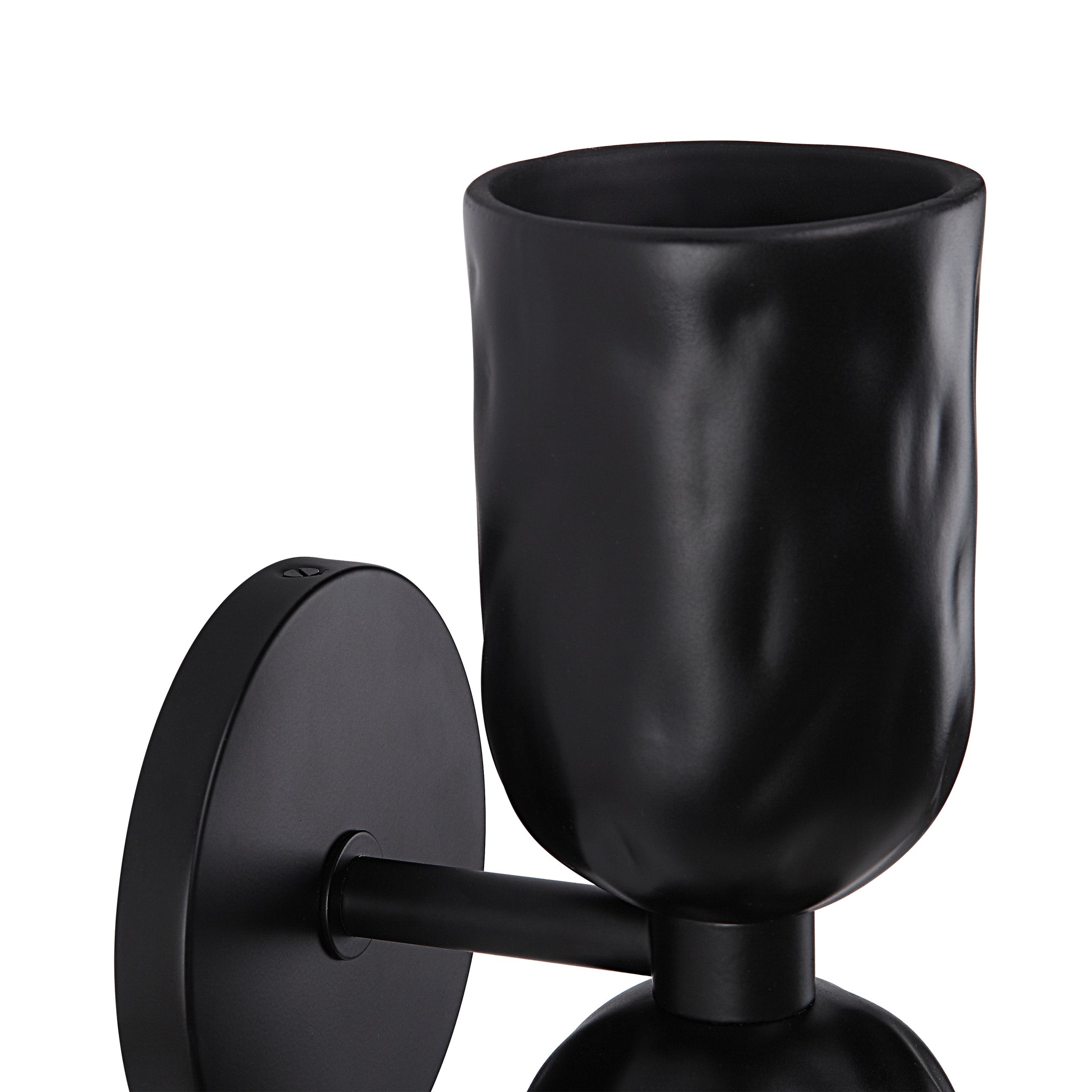Close-up of Alessia wall sconce in black, highlighting the textured cup and mounting details.