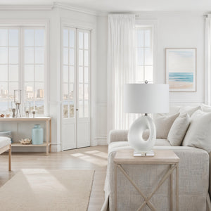 Opalis Table Lamp on a side table in a light-filled living room.