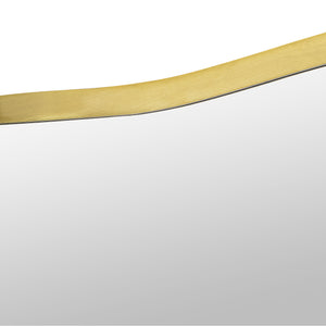 Close-up of the Nucleus Wall Mirror's gold frame highlighting its smooth edge.