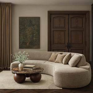Beatrix canvas art featuring abstract dark green tones, framed, displayed in a modern living room.