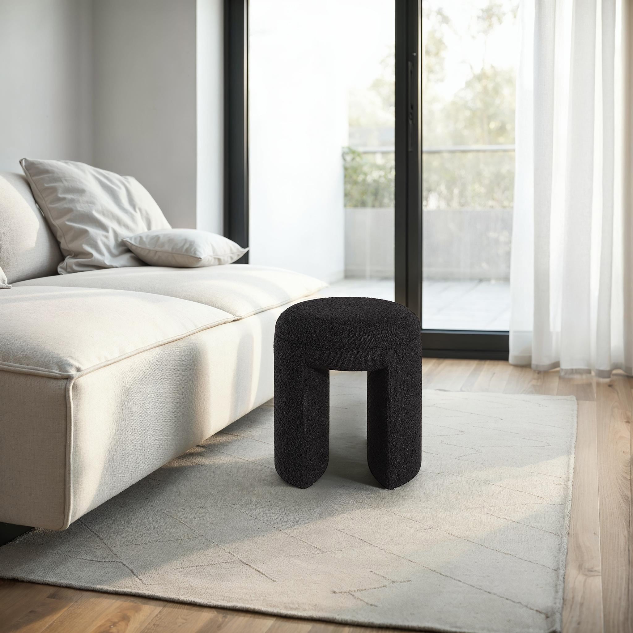 Amrah stool by Renwil in a modern living room setting beside a sofa