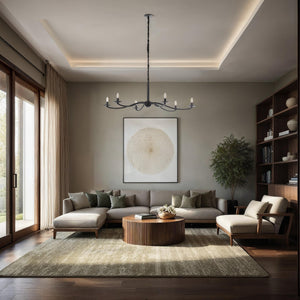 Landen chandelier by Renwil in a modern living room, illuminating a cozy seating area.