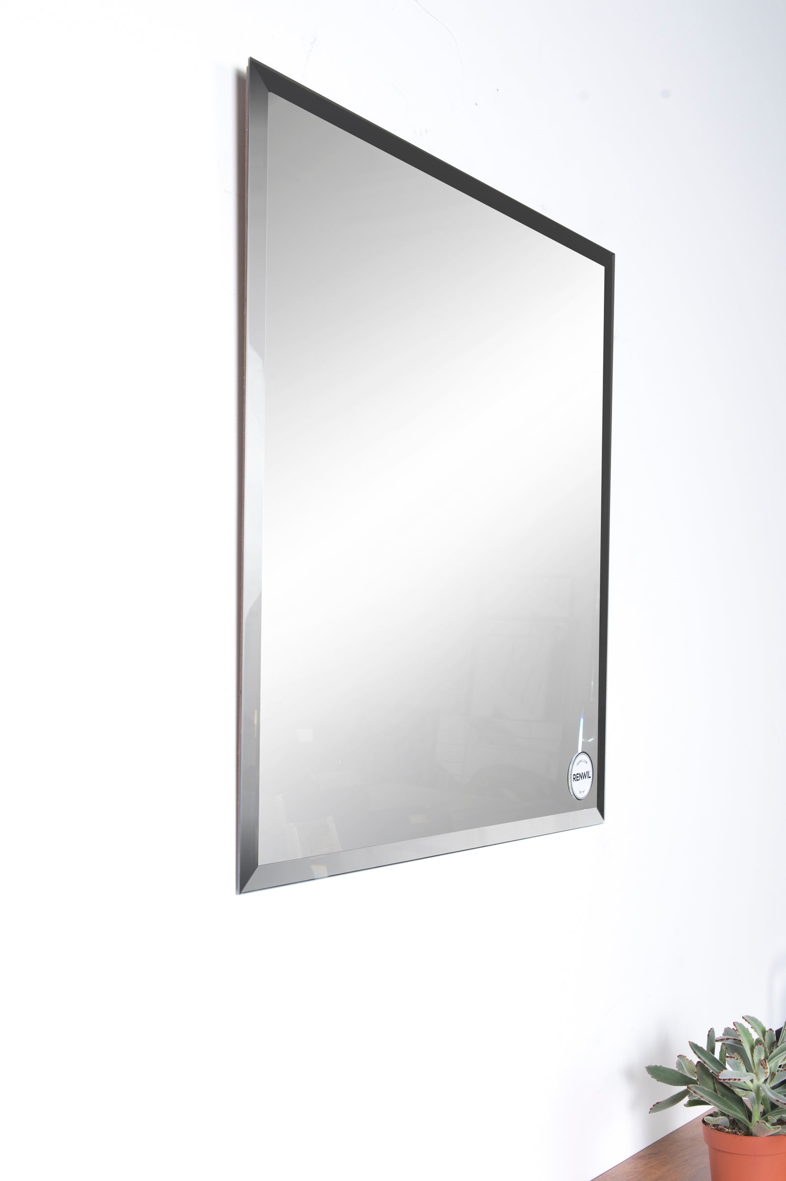 Vogue Wall Mirror with a sleek, square design and reflective surface.