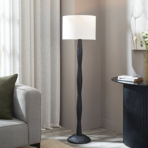 Francine Floor Lamp in a living room setting next to a sofa and decorative table
