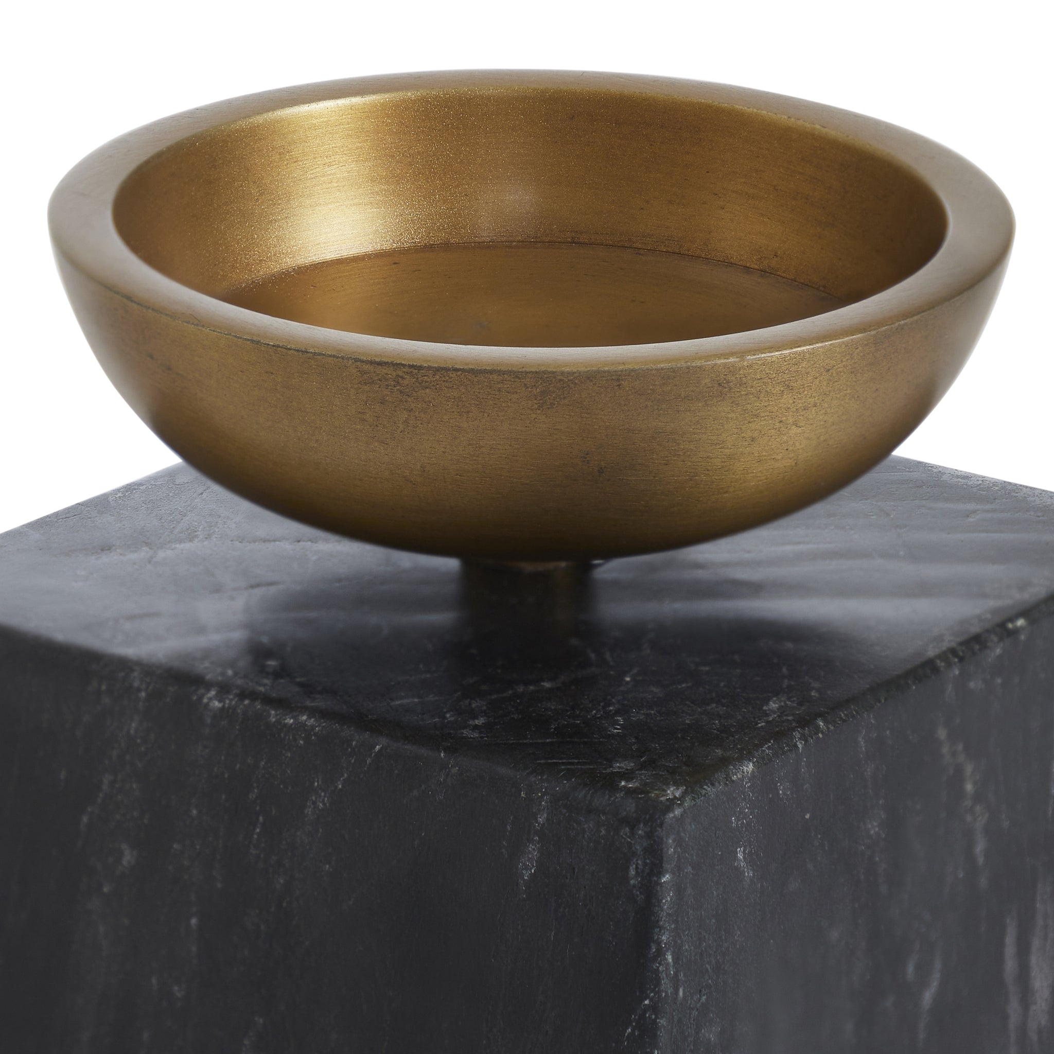 Poema candle holder featuring a round bronze bowl atop a black marble base, showcasing a modern design.
