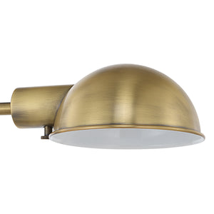 Halle Table Lamp dome shade in antique brass with a white interior for diffused light.