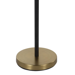 Base of the Mosaic floor lamp showing a round gold base and black pole.