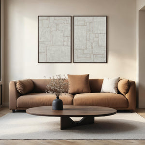 Living room setting featuring Caramelo wall art above a brown sofa with decorative vase.