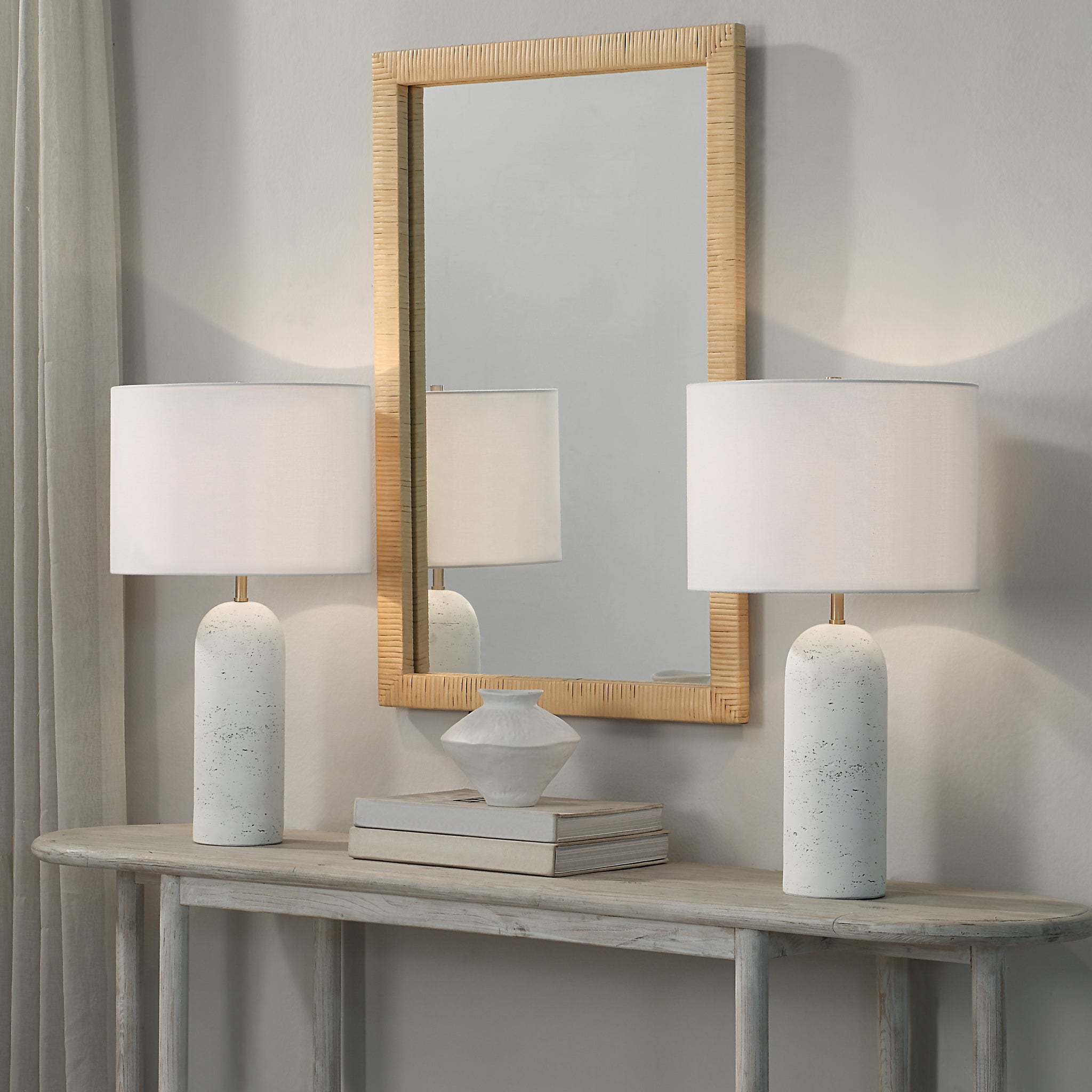 Dorato Table Lamps on a console table with a mirror, featuring white textured bases
