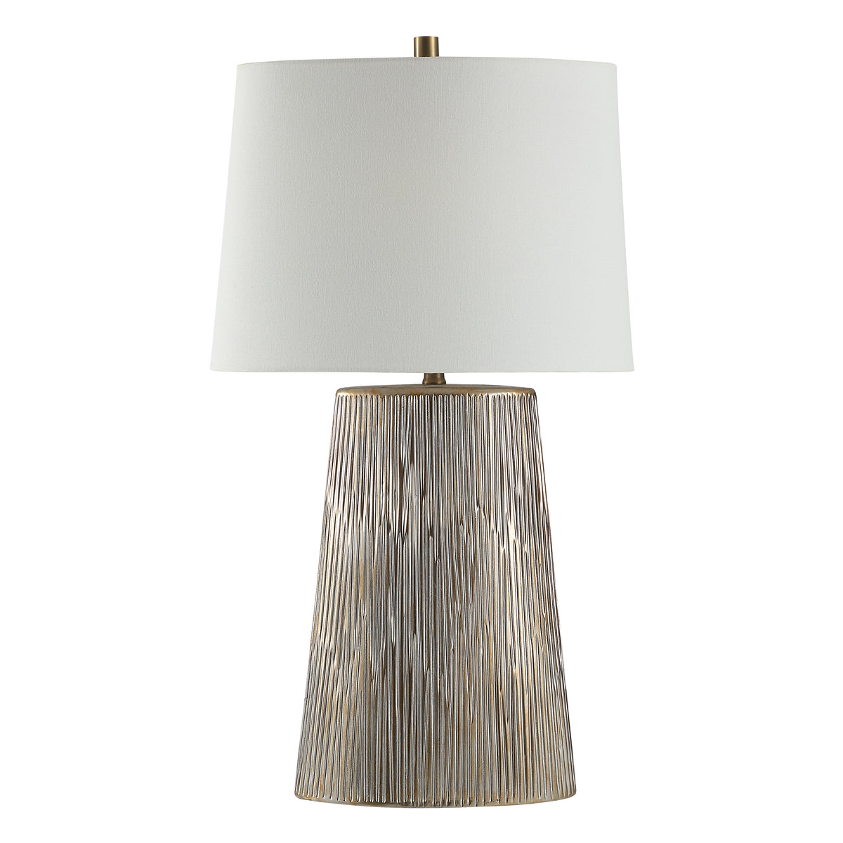 Calma Table Lamp with a textured silver base and white fabric shade
