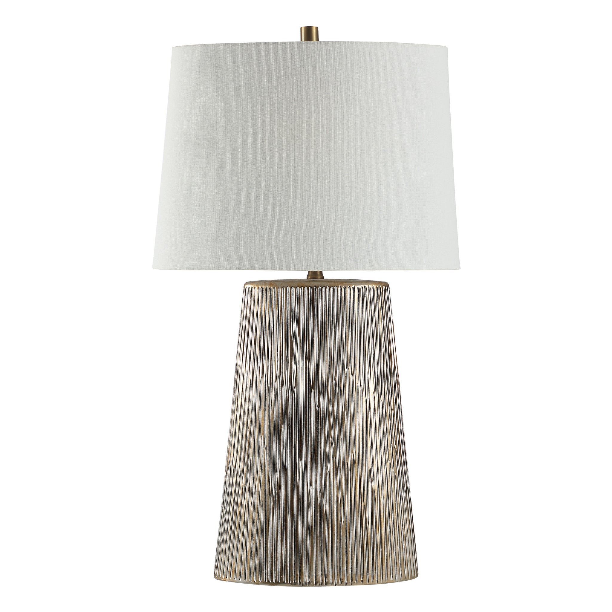 Calma Table Lamp with a textured silver base and white fabric shade