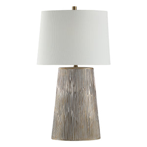 Calma Table Lamp with a textured silver base and white fabric shade