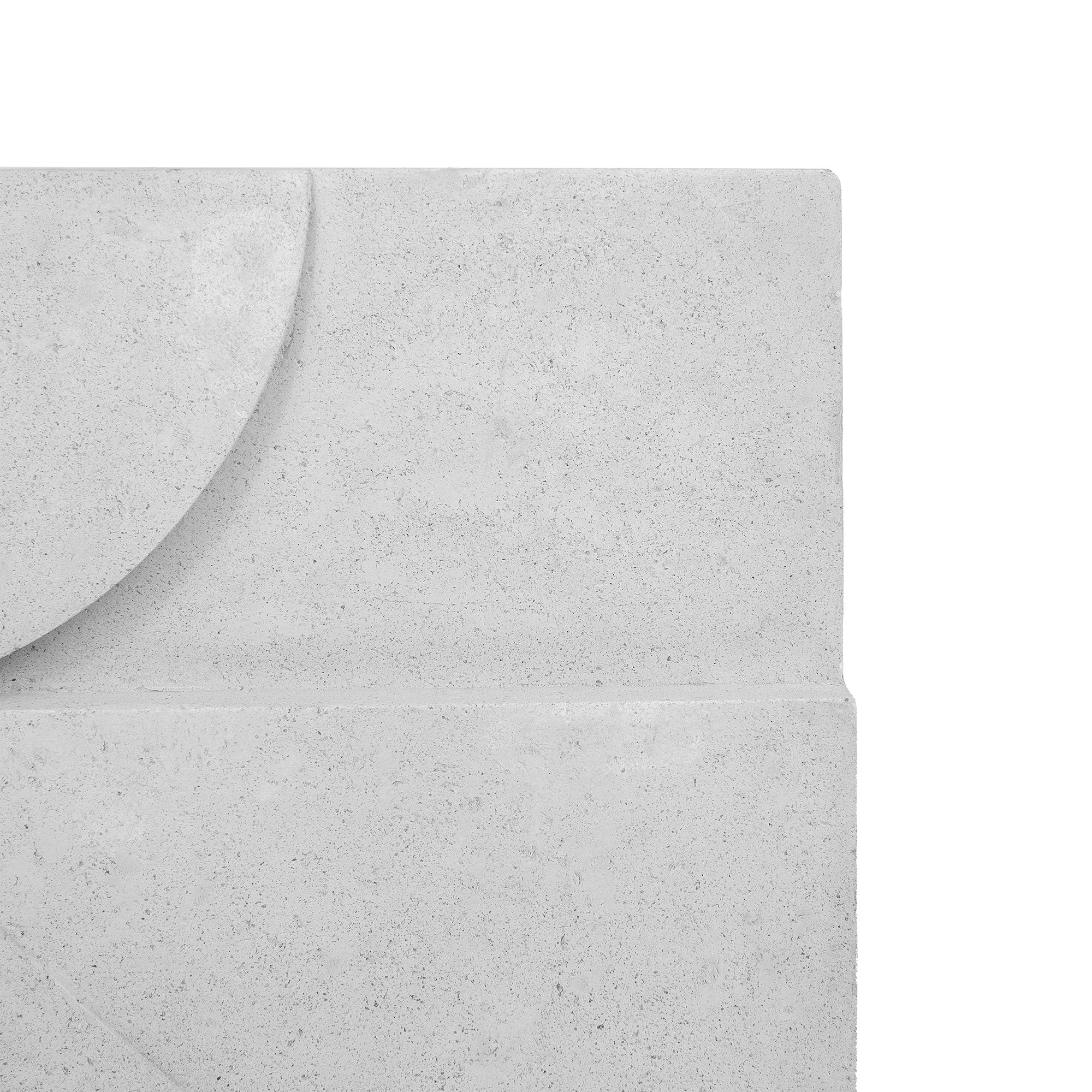 Close-up view of Sahara Wall Art, highlighting the smooth light gray concrete surface and geometric design.
